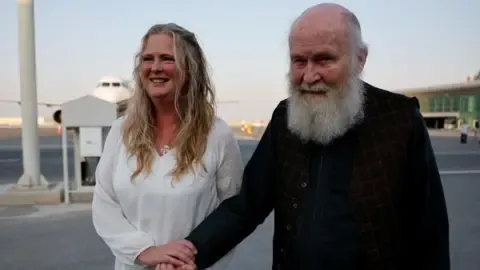 Son of UK Pair Held by Militant Group ‘Ecstatic’ as They Return to Britain